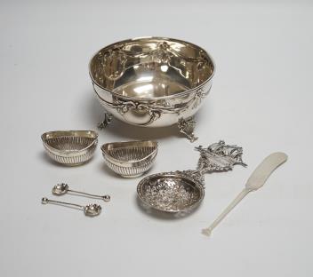 An early 20th century Austro-Hungarian white metal bowl, diameter 13.5cm, a pair of small silver oval salts with spoons, a silver butter knife and an ornate 800 standard white metal spoon.